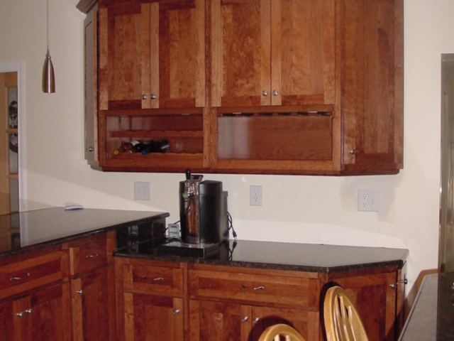 This Doylestown, New Britain, area shows a wall cabinet with wine bottles and glass stems area to give this kitchen a great custom area with all the added convenience to make cooking in your kitchen a pleasure.