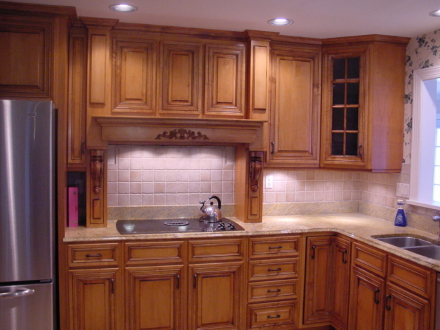 This Mount Holly, NJ home shows a custom wood hood and applied moulding doors.