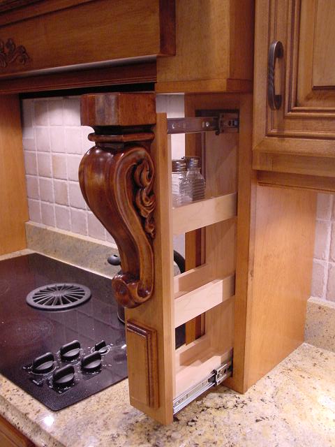 This Mount Laurel, NJ, shows custom pull out spice rack, a maple wood hood, giving this kitchen quick access to your most used items in the kitchen.