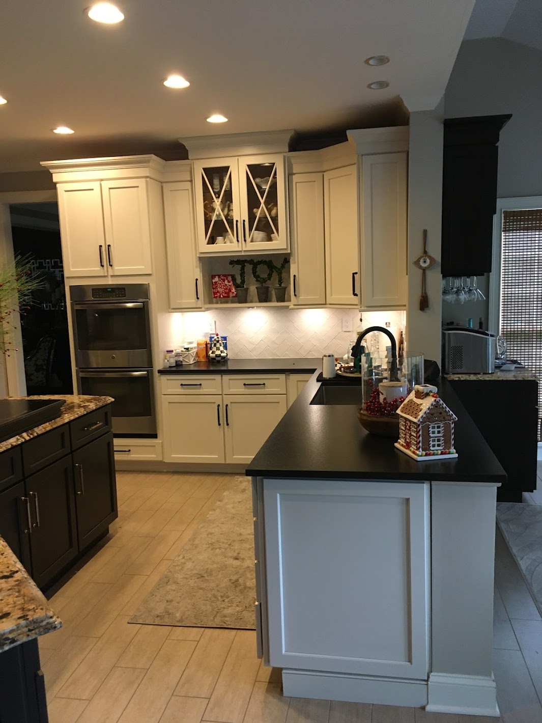 Main cabinets were finished in a white paint with glass door accents in this custom kitchen cabinet refacing transformation.